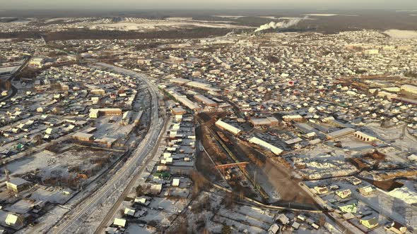 A Large Sawmill Located in Village Aerial View. Modern Woodworking Factory with a Railway Junction alt