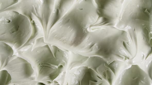 Motion of the Liquid Cream White Cosmetic Texture with Rotation alt