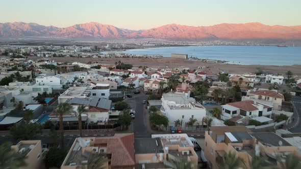 Panoramic Aerial View of Eilat Coastline at Evening with Ships Anchoring at the Red Sea Israel