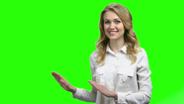 Smiling Woman Showing Place for Advertisement alt