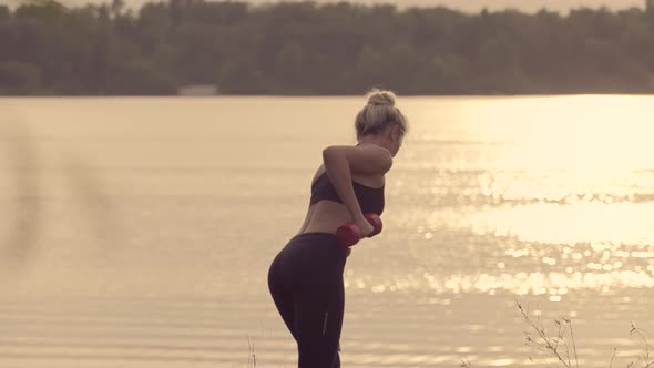 Woman In Sportswear Outdoor Exercise Body. Fitness Workout Dumbbell Training. Physical Training. alt