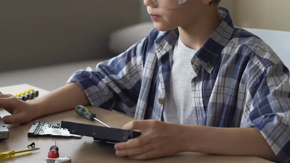 Schoolboy Searching in Internet How to Repair HDD, Young Talent, Dream Job alt