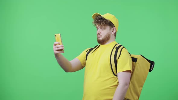 Portrait of Young Men Making Selfie on Mobile Phone Then Looking Photos alt