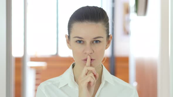Gesture of Silence by Woman, Finger on Lips alt