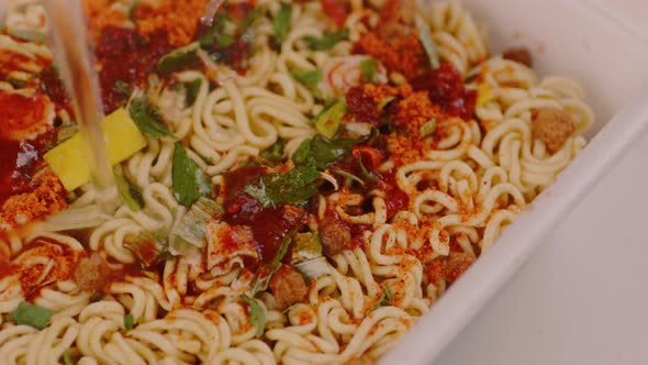 Dry Instant Noodles with Spices and Condiments in Styrofoam Packaging
