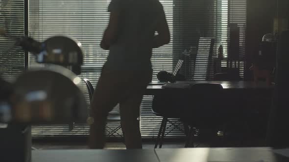 A Young Handsome Man Works in an Office Space alt