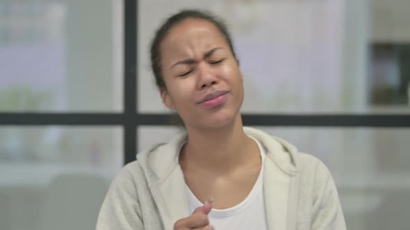 Portrait of Disappointed African Woman Reacting to Loss alt