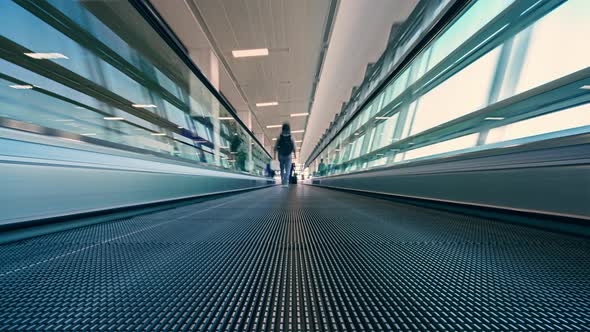 4K Motion blur timelapse of moving escalator in the Airport  alt