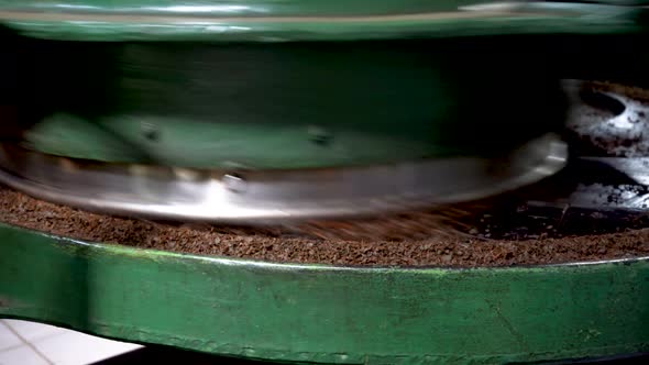 The Work of an Industrial Machine for Grinding Tea Leaves