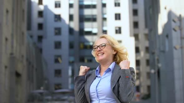 Joyful Business Lady Showing Yes Gesture Raising Hands Up, Goal Achievement alt