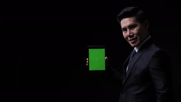 Businessman with tablet alt