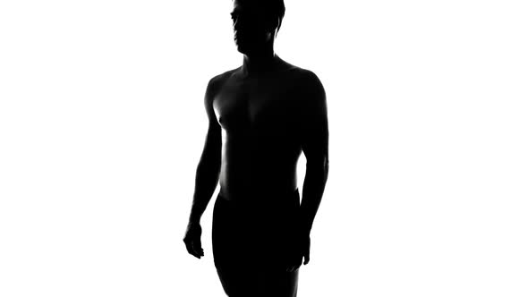 Naked Man Silhouette with Crossed Arms