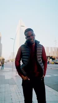 Stylish Black Man Walking Along Street alt