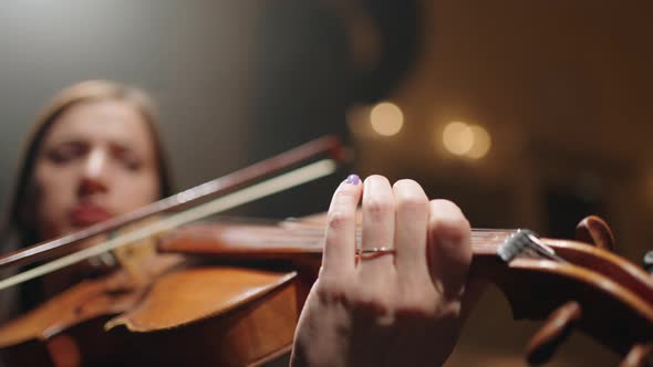 First Violin in Orchestra Closeup View of Fiddle in Hands of Female Musician Concert or Rehearsal in alt