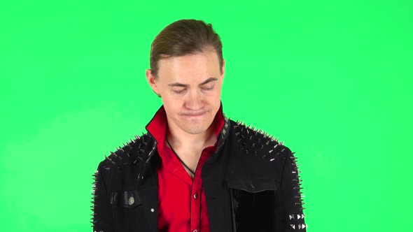 Man in Anticipation of Worries, Then Guilty Hides His Eyes. Green Screen alt