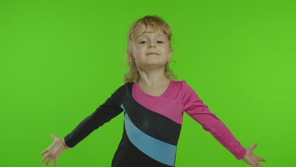 Child Ballerina Exercising in Studio on Chroma Key Background. Girl Kid Dancing, Making Gymnastics alt