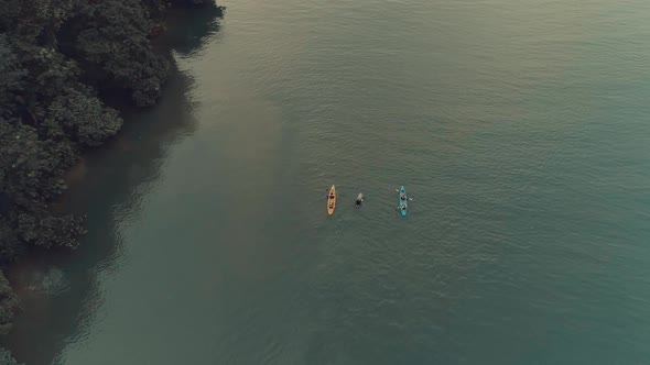 Drone footage during sunset from an elegant boat anchored at big river alt