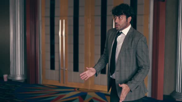 Man Wearing Suit is Dancing Like a Robot alt