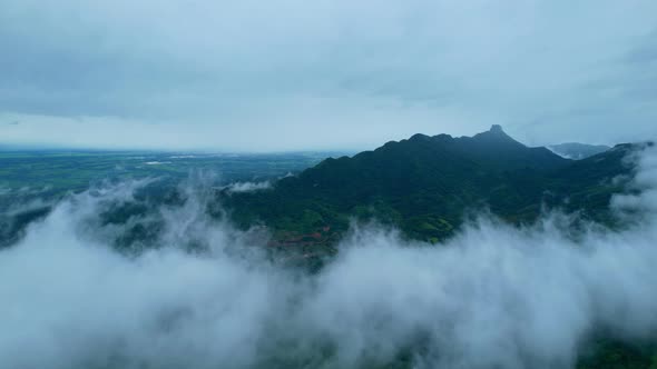 4K Aerial Drone shot flying over beautiful mountain ridge in rural jungle bush forest. alt