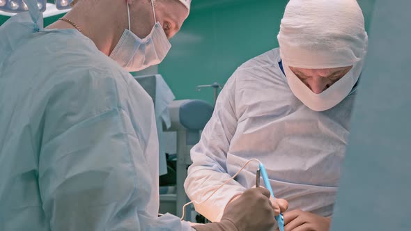 Surgeons are Working in a Team While Performing an Operation