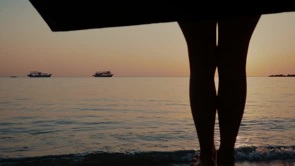 a Girl on a Swing Over the Sea