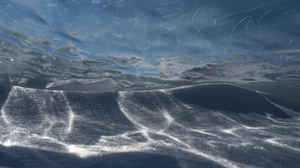 Timelapse of Sun Reflections Moving Trough Transparent Piece of Ice Floe