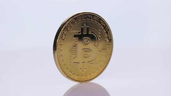 Rotating Bitcoin Cryptocurrency Digital Bit Coin on a White Background