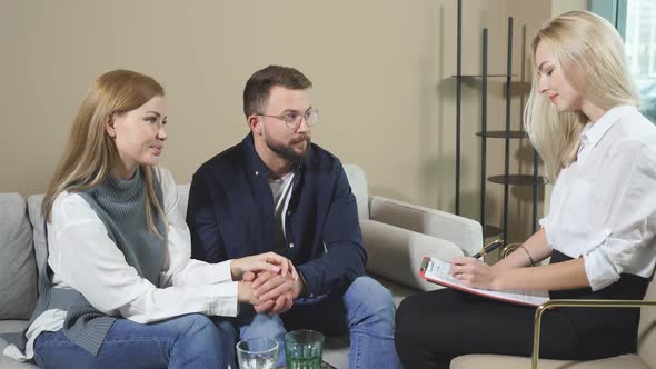 Caucasian Couple Visiting Professional Psychologist and Having Psychological Session