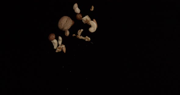 Different types of nuts, nuts in honey, nuts in slowmo, honey
