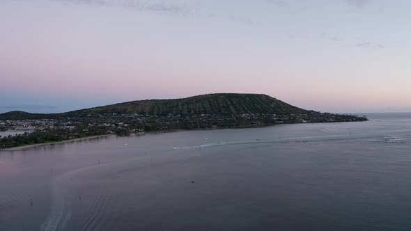 Wide aerial shot of a volcanic cone formation along the coast in O'ahu. Hawaii. 4K alt