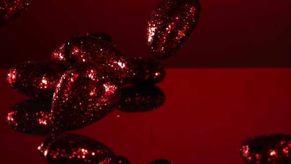 Decorations falling, bouncing in ultra slow mo 1500fps - reflective surface - VALENTINES PHANTOM 003 alt