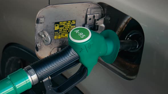 Different Gas Diesel Pistols At Gas Station alt