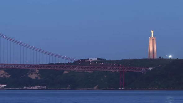 Bridge 25 De Abril on River Tagus at Twilight Lisbon Portugal Timelapse alt