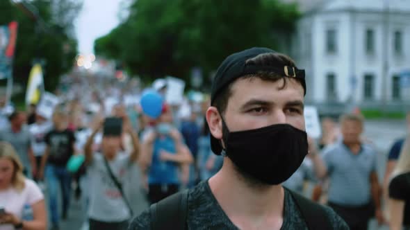 March Resistance Strike of Masked Protesting People Under Lockdown Restriction alt