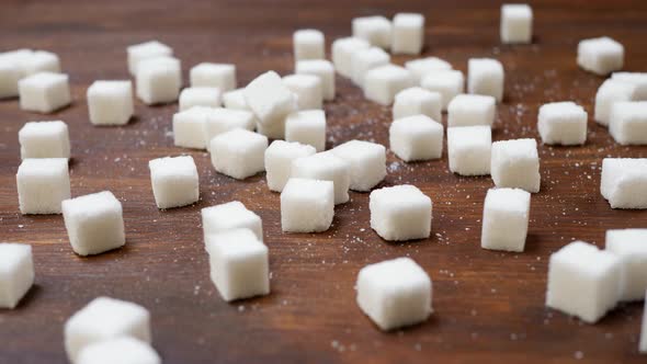 White Sugar Cubes on Wooden Brown Surface