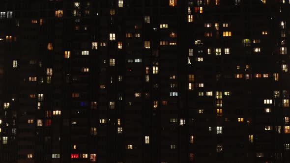 Windows at home. Light in the windows of a multi-story building. Time laps 
