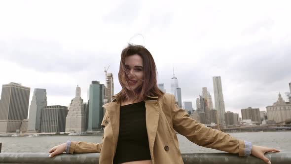 Attractive Woman Resting Near The Brooklyn Bridge. alt