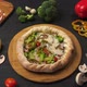 Presentation of Pizza on a Dark Brown Table with Its Ingredients - VideoHive Item for Sale