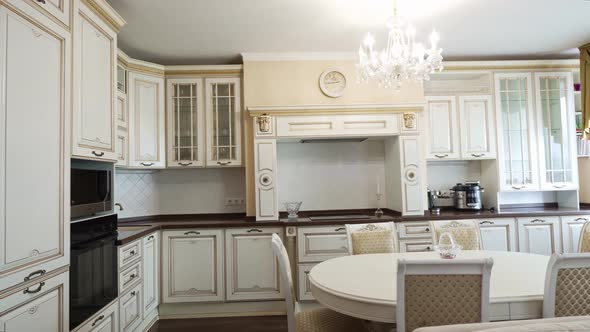 The Interior of a Large and Spacious Kitchenliving Room in a Classic Style alt