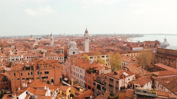 Narrow canals and orange rooftops in Venice alt