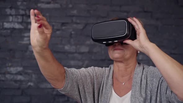 Matured Woman at House Using Virtual Reality Glasses