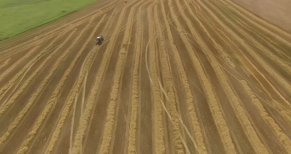Topdown View of Harvesters Working in a Wheat Field alt
