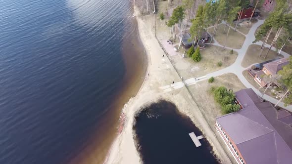 Aerial View of the Vuoksi River, the Forest and the Settlement in Autumn Day, Losevo, Leningrad