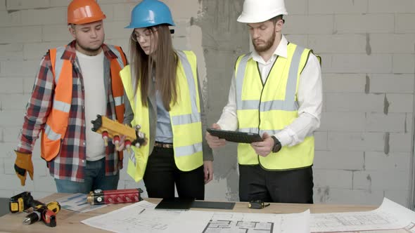 Young Architects and Technician Discussing