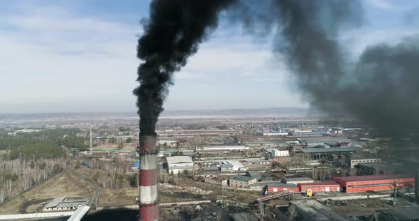 Smokestack at Coal-fired Power Plant Topics: Climate Change, Global Warming, Pollute Earth  alt