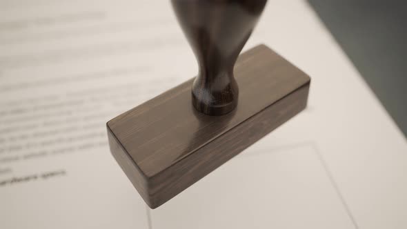 An important document being denied by red office stamp in slow motion. 4KHD alt