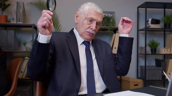 Elderly Old Businessman Checking Paperwork Correspondence at Office Shocked Surprised Disbelief alt