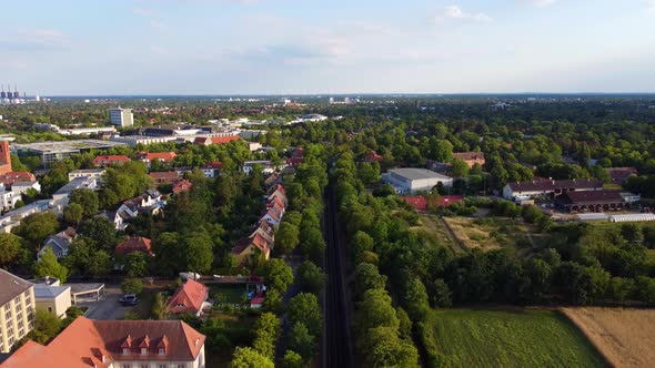 In the background the free university buildings.Smooth aerial view flight fly backwards drone foota alt
