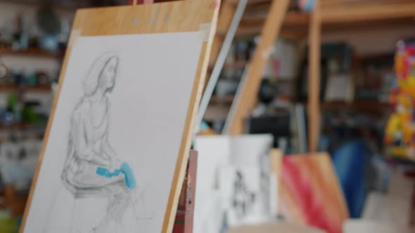 Close-up of Pictures Portraits of Woman Being Painted By Art Students Male and Female in Studio alt