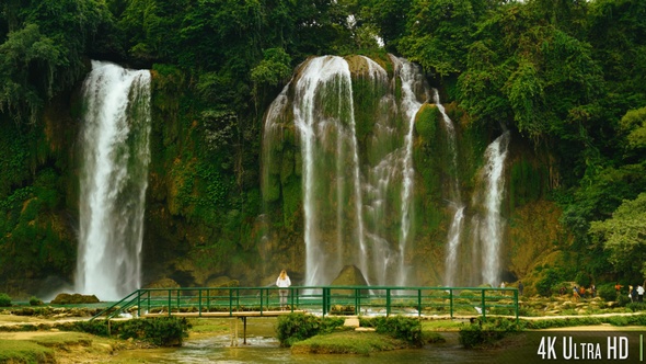 4K Back of Woman Standing in Front of Bao Gioc Waterfall in Cao Bang, Vietnam alt